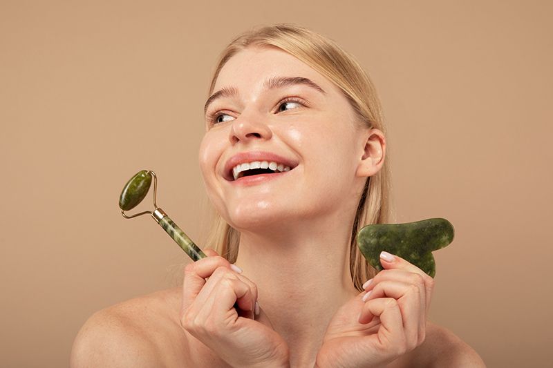 woman with face care tools