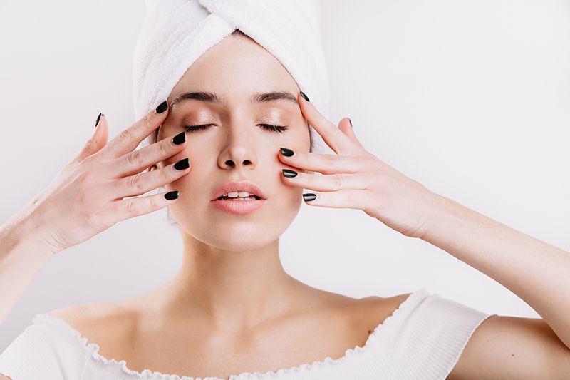 woman doing face massage