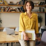 beautiful woman leaning on desk