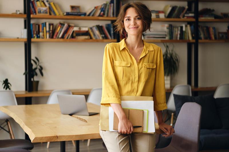 beautiful woman leaning on desk