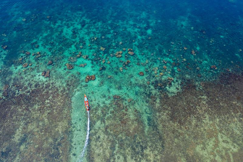 Aerial view of Long tail boats on the sea at Koh Tao island, Thailand.