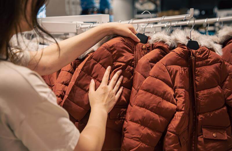 Sustainable coats hanging on a rack