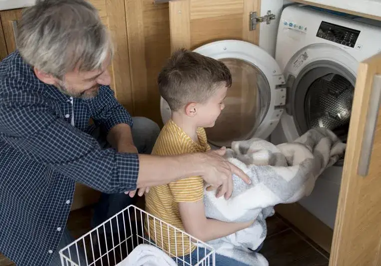 Blankets being washed in the washing machine