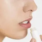 Person applying lip balm