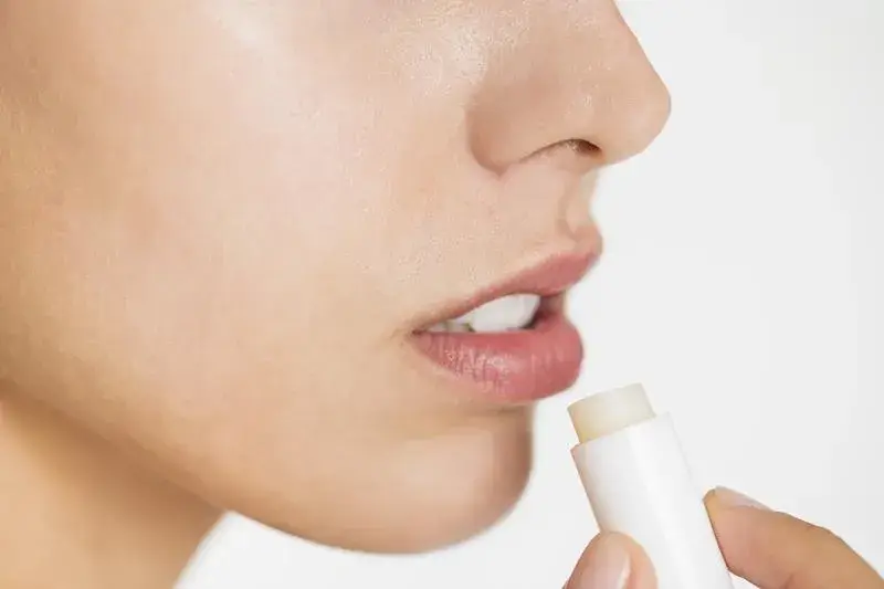 Person applying lip balm