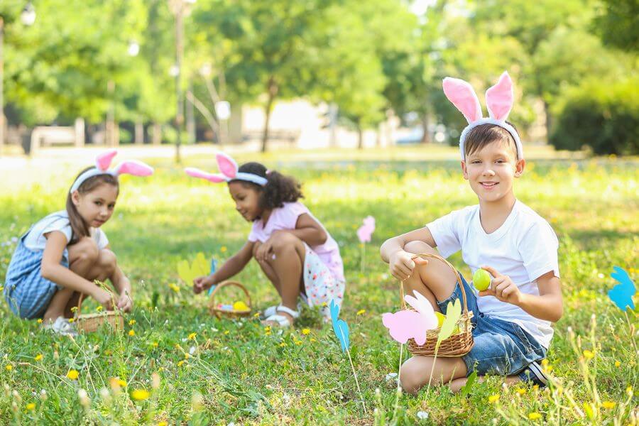 Happy kids playing with DIY Easter crafts